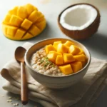 Mango Coconut Overnight Oats in a glass jar on a rustic wooden surface.